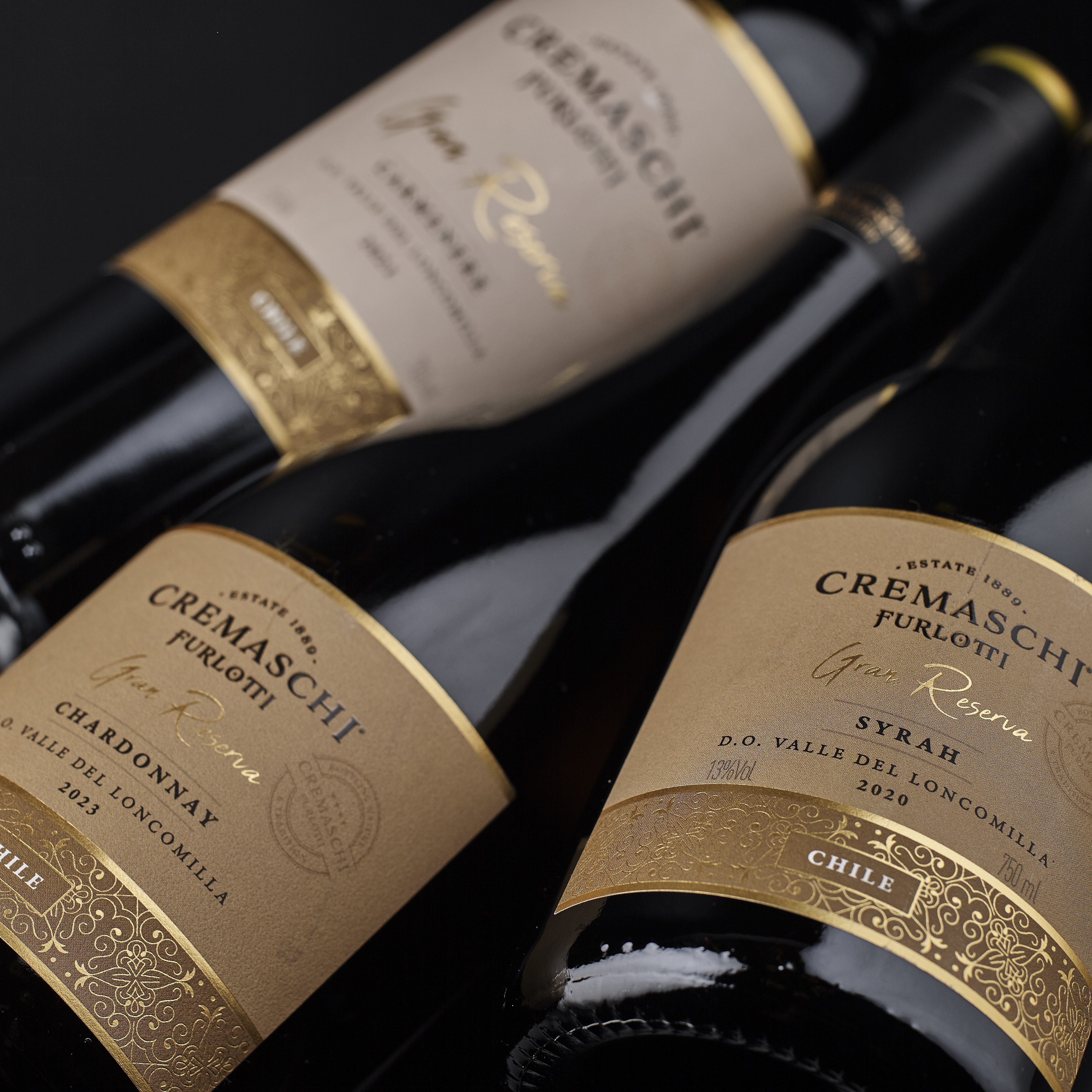 Botellas Cremaschi Furlotti Gran Reserva con etiquetas crema y detalles dorados.
