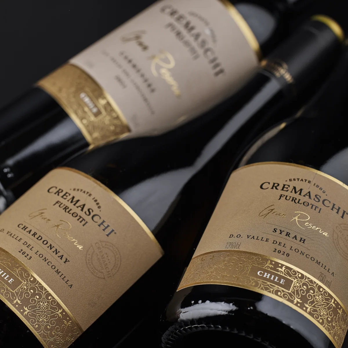 Botellas Cremaschi Furlotti Gran Reserva con etiquetas crema y detalles dorados.