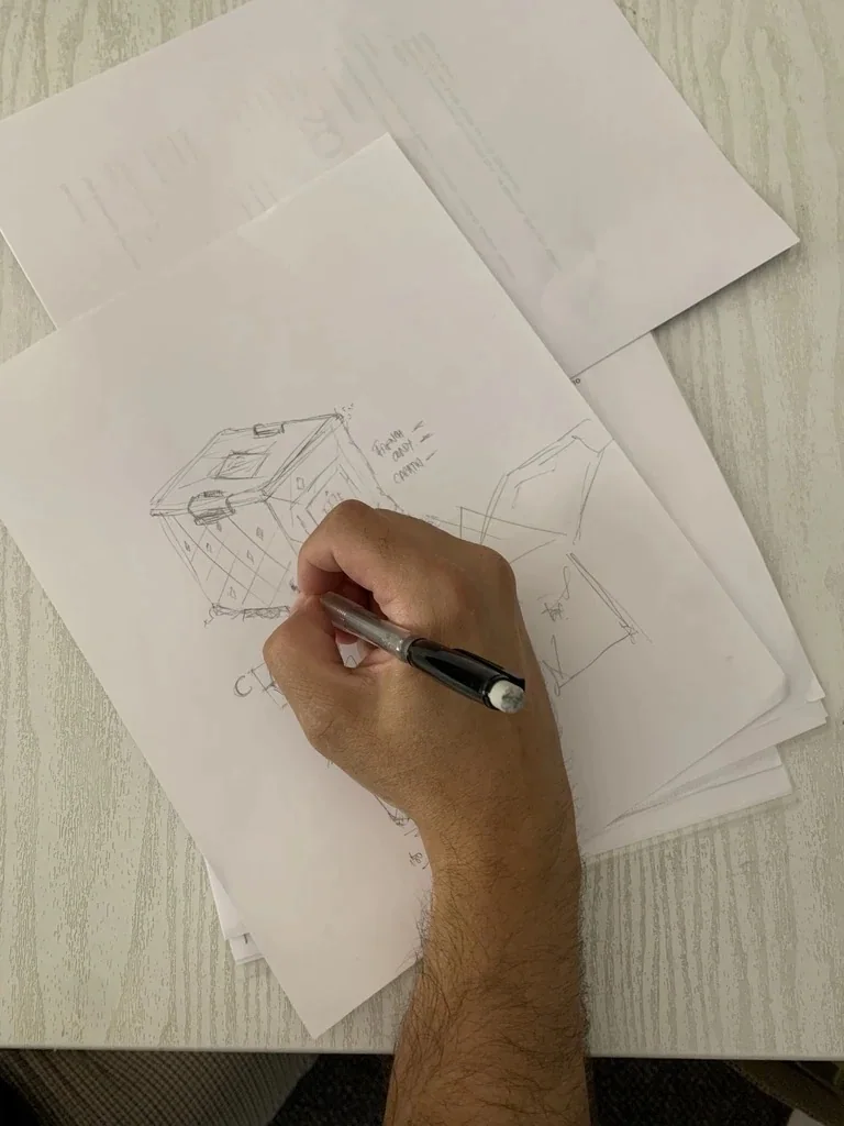 Boceto a mano del diseño de un estuche La Fête, dibujado a lápiz sobre papel